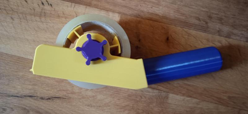 Unrolling tape machine / Strojek na odvíjení pásky