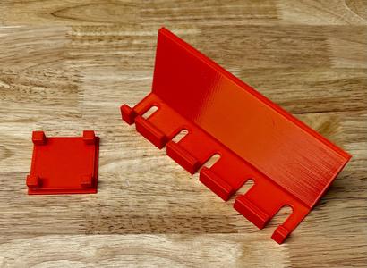 Screwdriver holder for 38mm x 38mm perforated wall