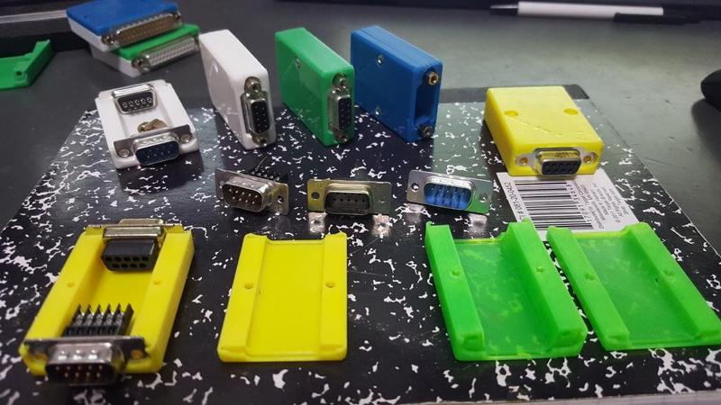 Adapter shell for DB9 to DB9 or HDDB15 connectors