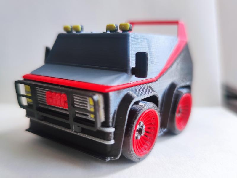 A team Van art toy Agence tout risque GMC