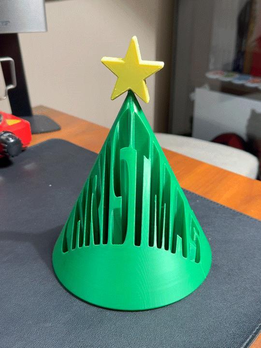 Christmas tree with hollowed-out logo MERRY CHRISTMAS tree