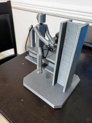 Welder sitting on steel construction