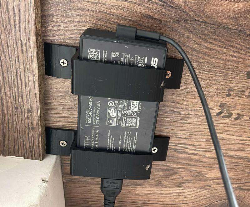 Laptop charger holder