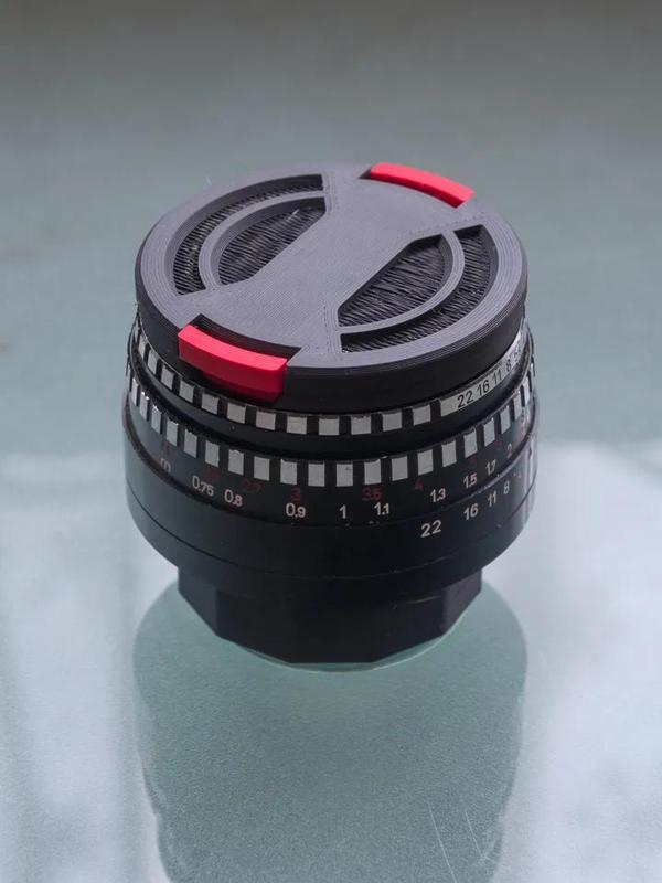 Ø49mm lens cap with raised rim   