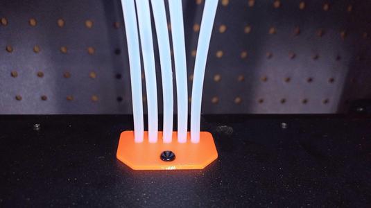 Hinged Lid Top Edge Plug for MMU