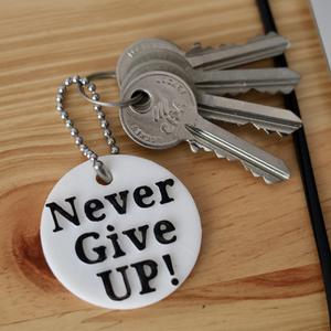 Never give up keychain. Stl file for 3d printing (print in place).