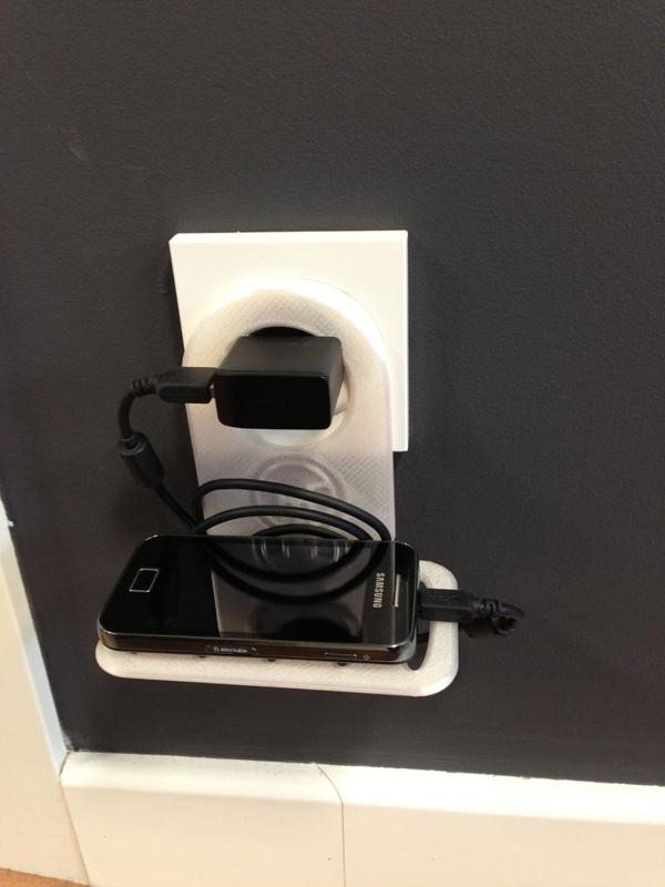 Support for charging mobile phones at any plug