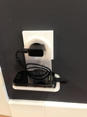 Support for charging mobile phones at any plug