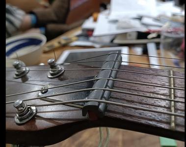 String Slide Nut Raiser