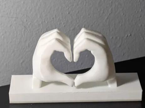 Hands making heart love symbol + Bookend