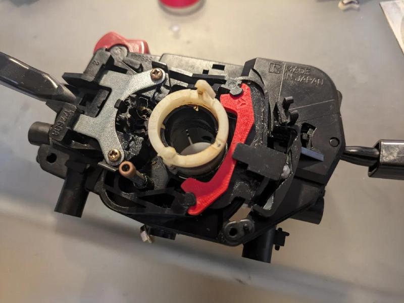 Mazda 323 BF turn signal cancel bar   