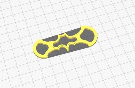Keychain is master key for shopping cart in the form a batman weapon slim