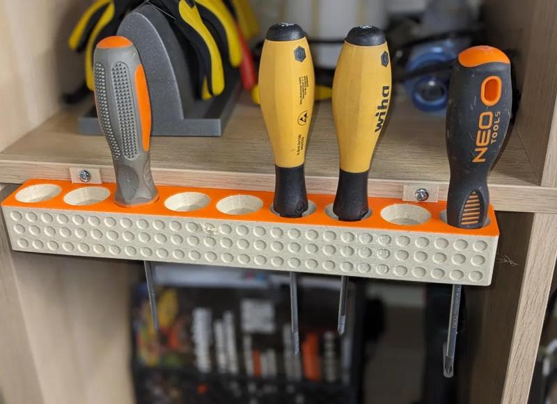 Universal screw driver holder   