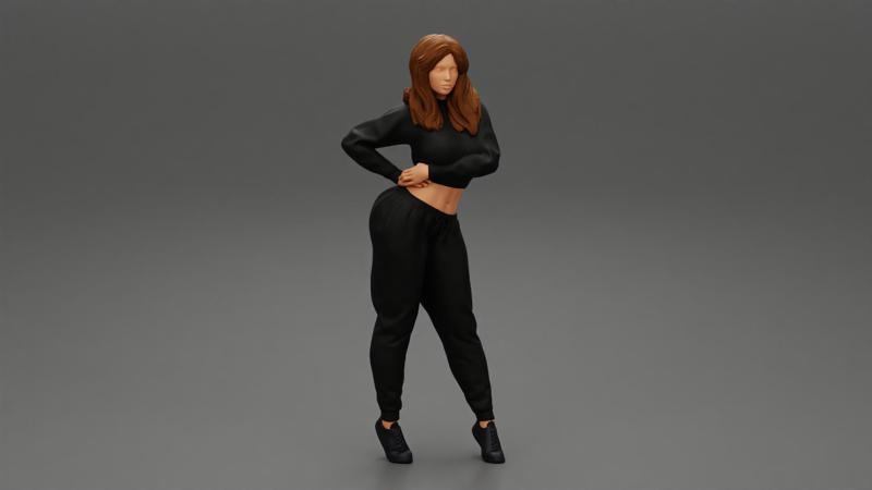 Young woman standing in sporty outfit