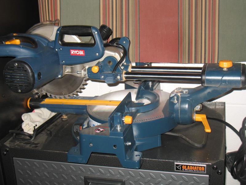 Bracket for holding electrical cord on a Ryobi saw