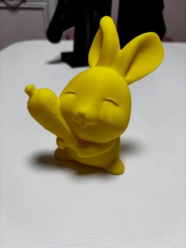 Easter bunny holding a carrot   