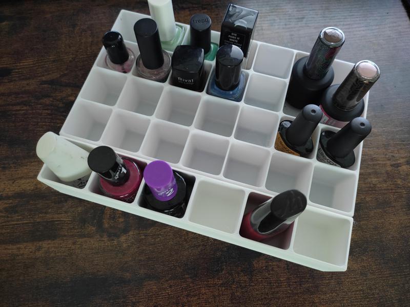 Nail polish tray with larger compartments