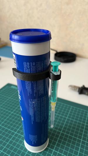 Syringe holder for tube with lubricant