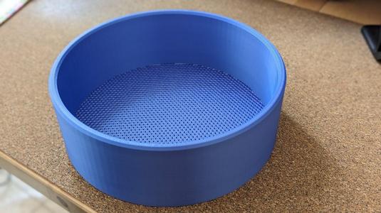 Sieve with 2mm hex holes, 210mm diameter, 70mm height.