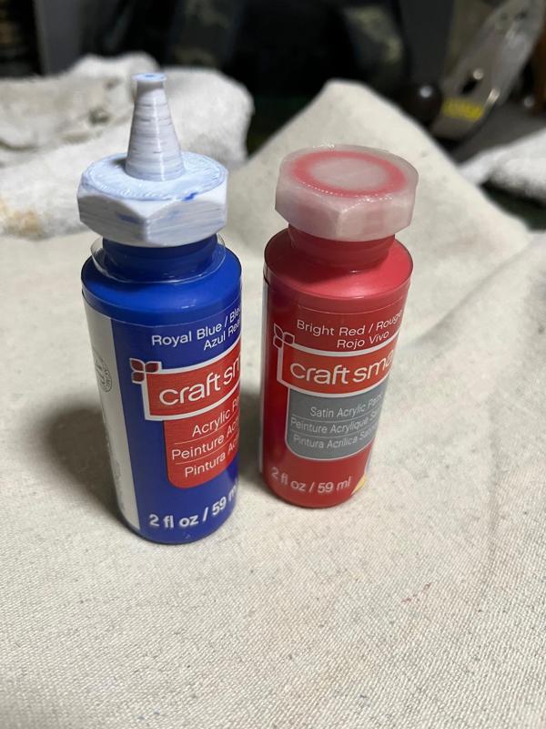 Hobby paint bottle squeezy top.