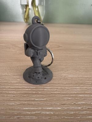 Mini Spaceman Footprint Keychain