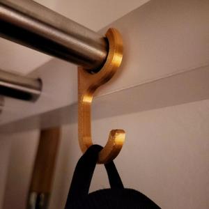 Rod held coat hanger hook