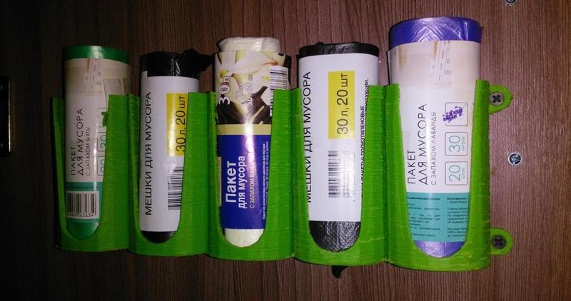 Holder of packages for garbage