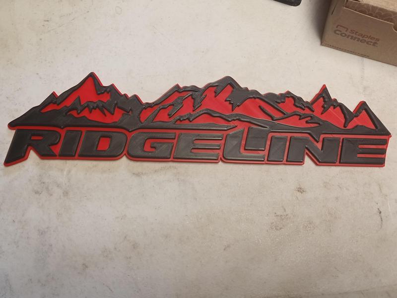 Dual color Ridgeline emblem badge