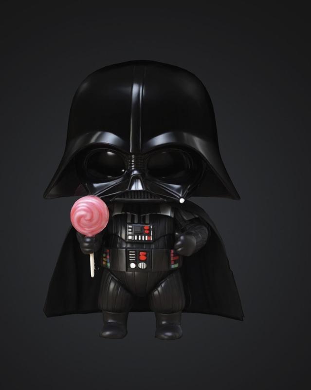 Baby Darth Vader holding lollipop