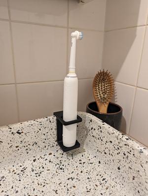 Electric toothbrush holder for 12mm sink