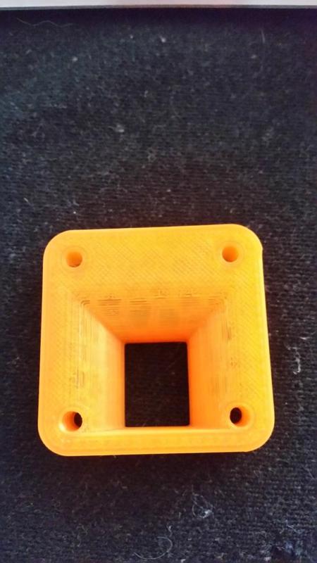 Spacer to improve function of radial fan mount on LPA layer fan