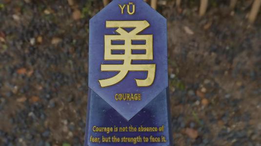 Tablet with motivational message about courage
