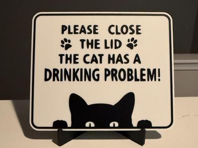 PLEASE CLOSE THE LID, THE CAT HAS A DRINKING PRBLM