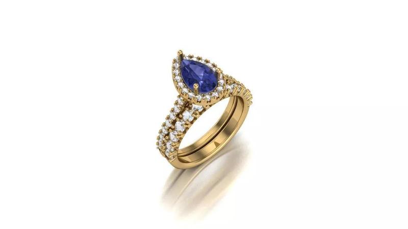 A Harmonious Union The Pear Tanzanite Halo Diamond Bridal Set