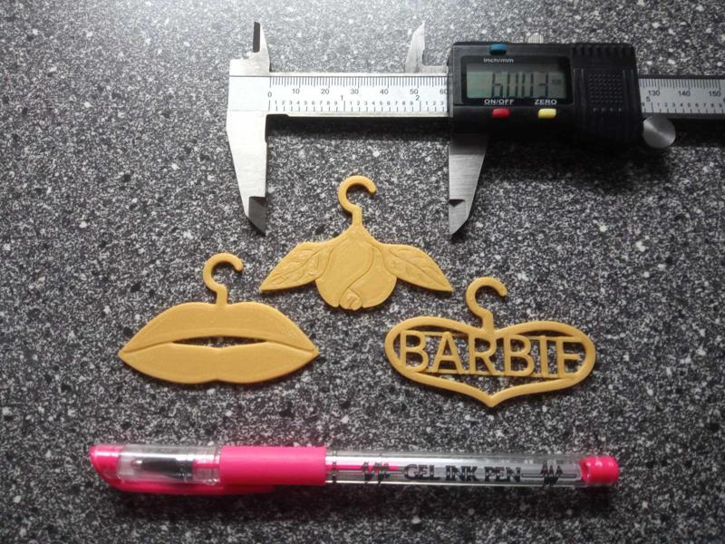 THREE HANGERS FOR DOLL CLOTHES - BARBIE