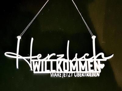 A hearty welcome would be an exaggeration Door sign