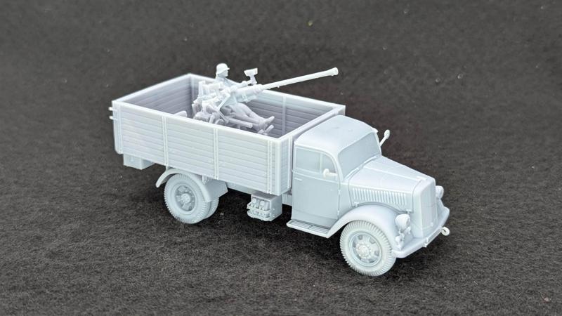 Opel Blitz with German Bofors 40mm FLAK 28 AA gun + Gunman (Germany, WW2)