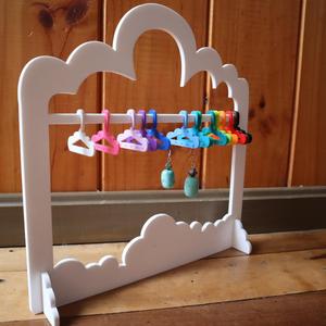 Coat hanger for earrings or jewelry.