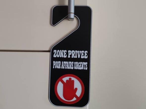 Humorous 'Do Not Disturb' Door Hanger