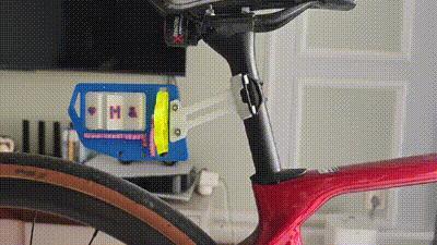 Windmill number plate, suitable for both bicycles and motorcycles.