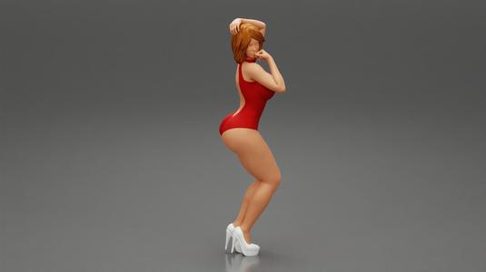 Attractive woman in one piece suit and heels posing