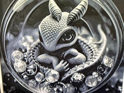cute baby dragon in sphere with jewels 
