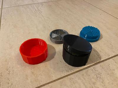 Three-deck grass chopper with lower tank.