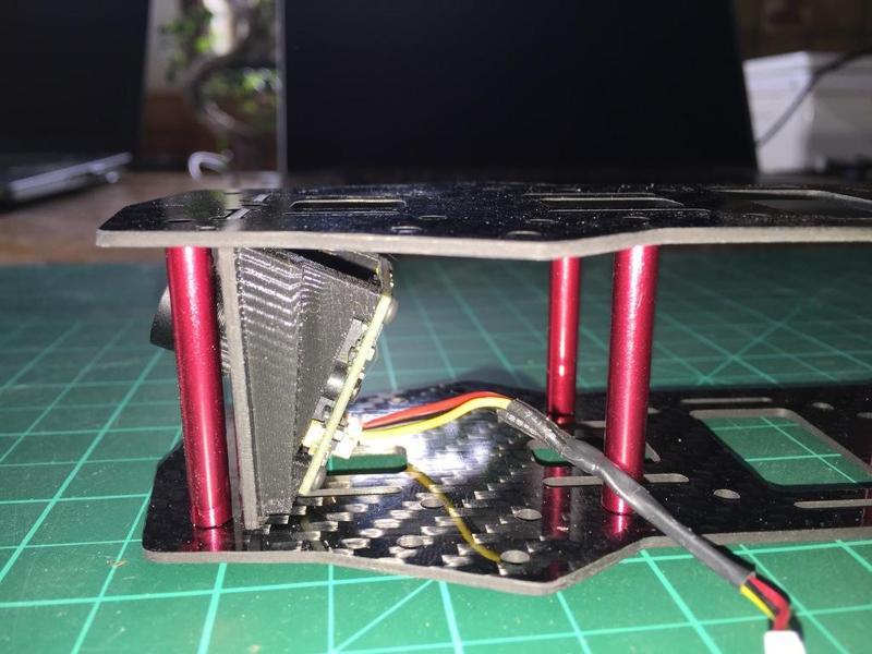 Runcam 24mm PZ0420 PCB FPV cam adapter to 28mm mounting plates (ZMR 250) with 25° angle.