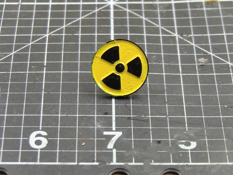 Radiation enamel pin