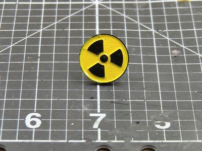 Radiation enamel pin