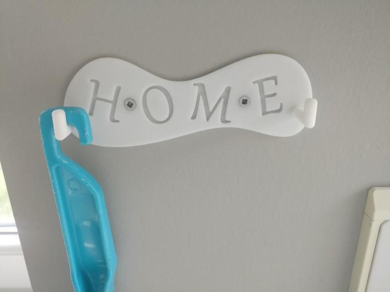 Hook for brush and kitchen washbassed