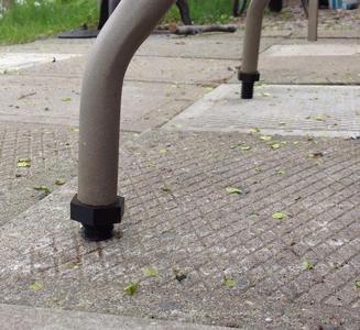 Patio table level adjuster