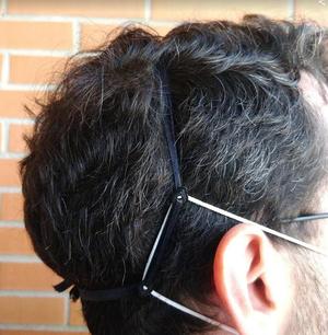 Mask strain relief / ear saver with ribbon