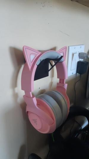 Tape mounted headphone holder